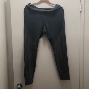 Gray workout leggings with gold glitter legs.